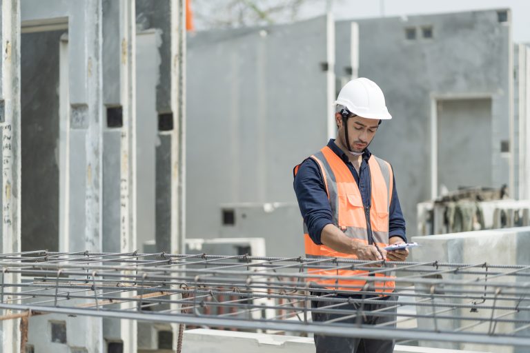 Male engineers are inspecting and controlling the work of the em