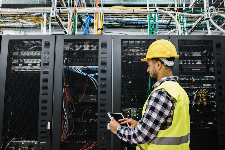 young-technician-man-working-inside-big-data-cente-2026-01-11-08-10-12-utc